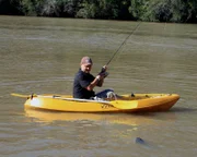 BRISBANE RIVER, BRISBANE, AUSTRALIA: Paul Worsteling fishes from a kayak in the Brisbane River. The waters are notorious for a large population of aggressive bull sharks.  (Photo Credit: © Hoff Productions)