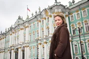 Lucy Worsley in front of the Winter Palace, Saint Petersburg.