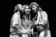 NEW YORK - SEPTEMBER 7: Maurice Gibb, Robin Gibb and Barry Gibb of The Bee Gees harmonising around a microphone while performing on stage at Madison Square Garden on the Spirits Having Flown Tour on September 7th, 1979 in New York. (Photo by Richard E. Aaron/Redferns)