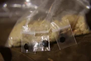 MEXICO- A bag of Heroin & little baggies of black tar heroin at a street dealers house.