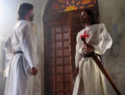 Hughes de Payen greets a Templar guard.