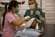 Dr. Sandra Lee and Medical Assistant Kristi perform surgery on Josh.Dr. Sandra Lee and Medical Assistant Kristi perform surgery on Josh.