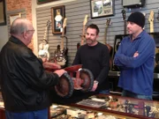 Scott and Brian examine a toy tractor