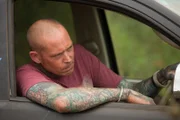 DURBAN, SOUTH AFRICA- Simon Keys looking out the front drivers window of a car while driving. Simon catches snakes in Durban and releases them in safe places away from human contact.