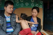 Gaurab Gurung with his mother Kalpana Gurung and father Ashish Gurung.