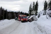 Overhalla, Norway - Truck in the ditch and towing trucks ready to rescue.