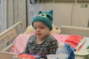 Patient Lucy Wiese gets ready to play a card game with her nurse.