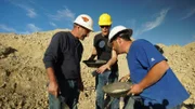 Dave, Clark and Jason (L-R) looking into Clark's hand for gold