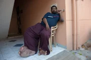 Arun P Rajasingh sitting outside on chair.