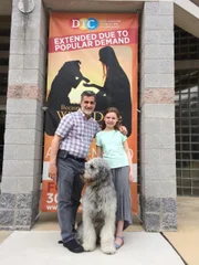 Bill Berloni, Kylie McVey and Bowdie posing in front of Because of Winn Dixie Promotional Poster.