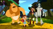 L-R: The Cowardly Lion (voiced by Jess Harnell), Dorothy Gale (voiced by Kari Wahlgren), The Scarecrow (voiced by Bill Fagerbakke), The Tin Man (voiced by J. P. Karliak)