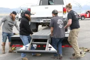 Unloading the two vehicles for the 2 wheel stunt test.