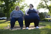 Michelle and Amanda sitting on a park bench.