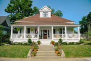 Exterior revealr shot of the historic Laurel home, envisioned by hosts Ben & Erin Napier, as seen on Home Town.