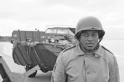 Picture shows_Drama reconstruction_William Dabney (Luke Charles) in front of DUWK amphibious vehicle