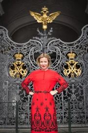Lucy Worsley in front of the Gates of the Winter Palace, Saint Petersburg.