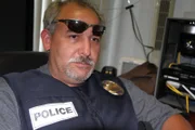 Laredo, TX: Investigator Rodriguez takes a break after searching a suspected drug dealers house.