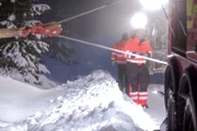 Overhalla, Norway - Jo Roger (one of the main cast in the North) is steering the wire that is attached to a hook. Tries to help a truck up from the ditch.