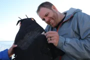 Josh Gates finds a Great White shark tooth.