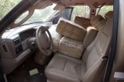 Brownsville, TX, USA: Looking inside an abandoned pickup truck filed with bundles of contraband.