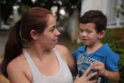 Otavio Pimentel is held by his mother Janaína Pimentel.