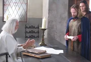 A nobleman exchanges money for a coded letter of credit from Templar.