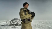 Joel Lambert with binoculars.