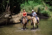 First from the left: Gaia Vince riding a horse