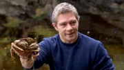 Matt cleans crabs for breakfast.