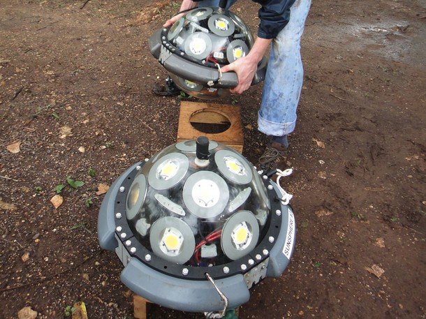 Pisté, Mexico - Eric Berkenpas works with National Geographic sun spheres. These sun spheres will light up the abyss of the cenote like never before.