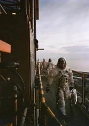 Neil Armstrong and Buzz walk across the mobile launcher to enter their Apollo 11 spacecraft.