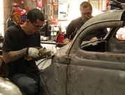 Jerome Mena and Benjamen Flores work on car. Build Car is 1936 Ford Coupe.