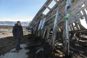 Picture Shows: Andrew Graham-Dixon beside a shipwreck near Tromso, Norway
