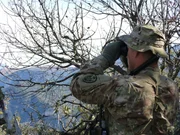 Wendell Sparks looks out his binoculars.