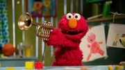 Elmo verabschiedet sich mit einem Wimmelbild.