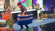 Aktionsspiel "Wakeboard" v.l.n.r. Katrin Müller-Hohenstein, Kostja Ullmann und Mirja Boes.