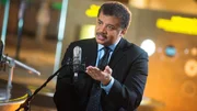Neil deGrasse Tyson on the set of his new talk show series "StarTalk" filmed with a live studio audience in the Hayden Planetarium at the American Museum of Natural History. "Star Talk" premieres on National Geographic Channel in April. (photo credit: National Geographic Channels/Scott Gries)