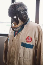 A mannequin wears an old gas attendant's outfit.