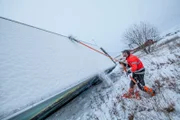 Overhalla, Norway - Roar Skjeflo (one of Jo Roger´s employees) attaches a strap to the truck in the ditch.