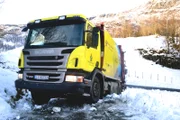 Odda, Norway - The truck that has problems and needs help to get the wheel back on the road.