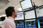 Picture Shows: Most financial trading is electronic. Day trader Scott Redler, the Chief Strategic Officer at T3 Trading Group, looks up at his screens
