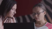 Chelsea and Jessica Schobert talk over the computer.
