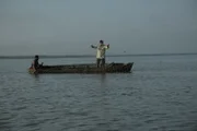 Lake Nicaragua, Nicaragua, Central America: Zeb joins a local fishermen checking his nets on Lake Nicaragua.