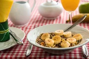 Cereals with bananas on the table