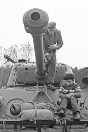 Picture shows_Drama reconstruction_Okill Stuart on tank with French Boy