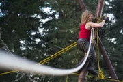 Bear Brown climbs piling.