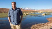 ATACAMA DESERT, CHILE, MAY 5 2017: Expedition Unknown host Josh Gates near a rare body of water in the Chilean Andes in the Atacama desert, the driest non-polar desert in the world, whose soil has been compared to that of Mars, owing to its otherworldly appearance, but also because bacteries and rocks in its geysers are believed to be similar to the ones in Mars' old geysers, prompting scientist to study them in order to better understand Mars' geology and plan future missions to the red planet.