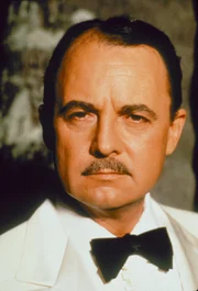 Higgins (John Hillerman)