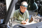 Museum of the Jewellery Quarter, UK : Clive Heeley, jeweller recreating onbe of the pieces of the hoard using modern jewellers tools. (Photo credit: © Fulcrum TV)