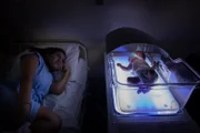 Karine looking at Pierre in the incubator